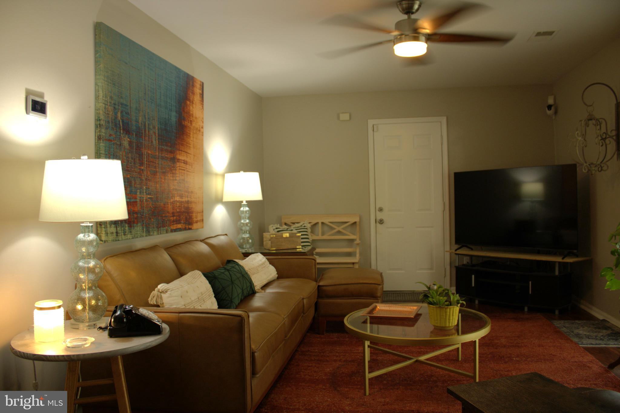 3910 Oaklawn Road Fort Washington, MD 20744 - Photo 7 of 17 a living room with furniture and a flat screen tv