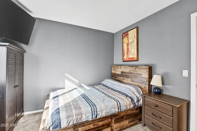 a backyard of a house with barbeque oven table and chairs