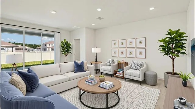 a living room with furniture potted plant and a lamp