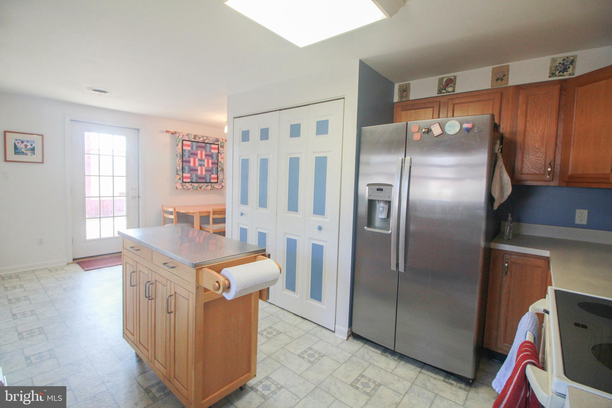 2154 Cecilton Warwick Road Warwick, MD 21912 - Photo 29 of 44 Kitchen island, refrigerator and laundry area