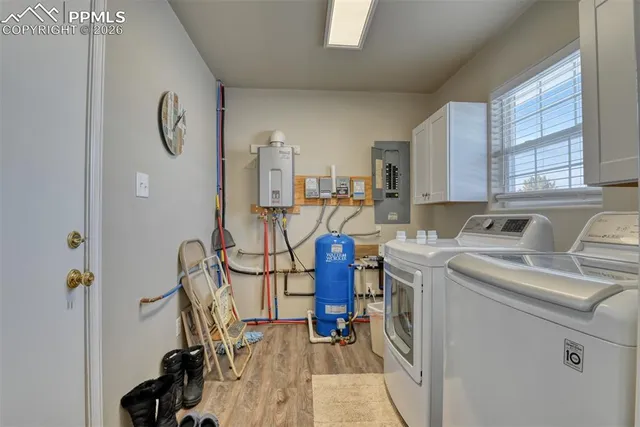 a bedroom with a bed and a chandelier fan