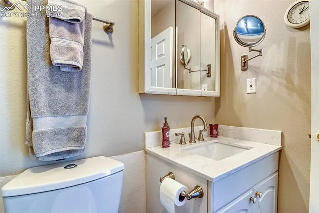 a view of a livingroom with furniture and a window