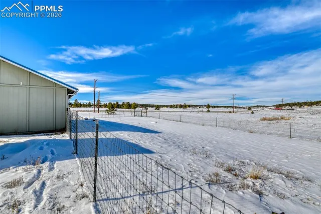 a view of a swimming pool and an outdoor seating