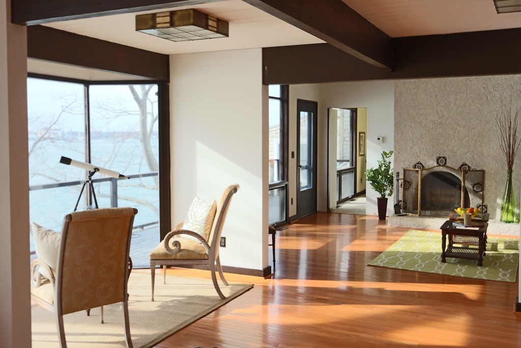 19 Neptune Road Marblehead, MA 01945 - Photo 2 of 16 a dining room with furniture a floor to ceiling window and wooden floor