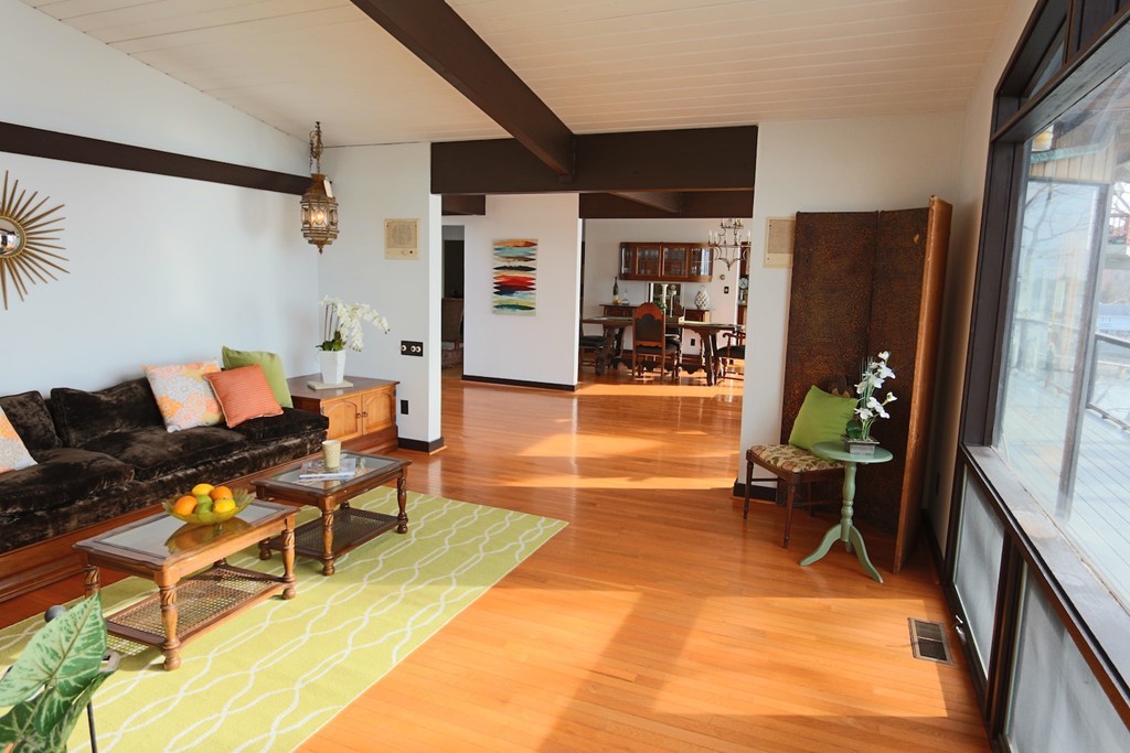 19 Neptune Road Marblehead, MA 01945 - Photo 6 of 16 a living room with furniture a dining table and chairs with wooden floor
