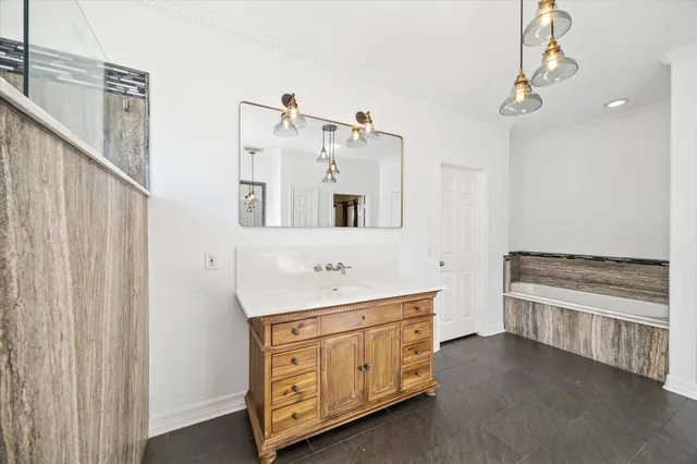 a bathroom with a double vanity sink a mirror and a