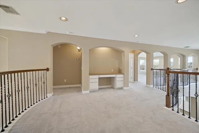 a view of a hallway with windows