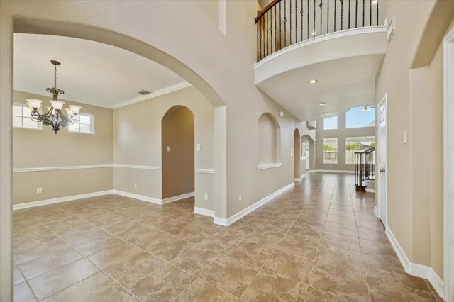 a view of a hallway view with staircase