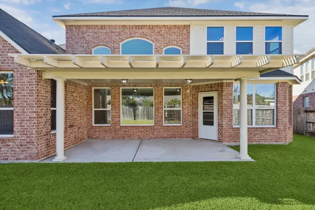 a view of a brick building with many windows