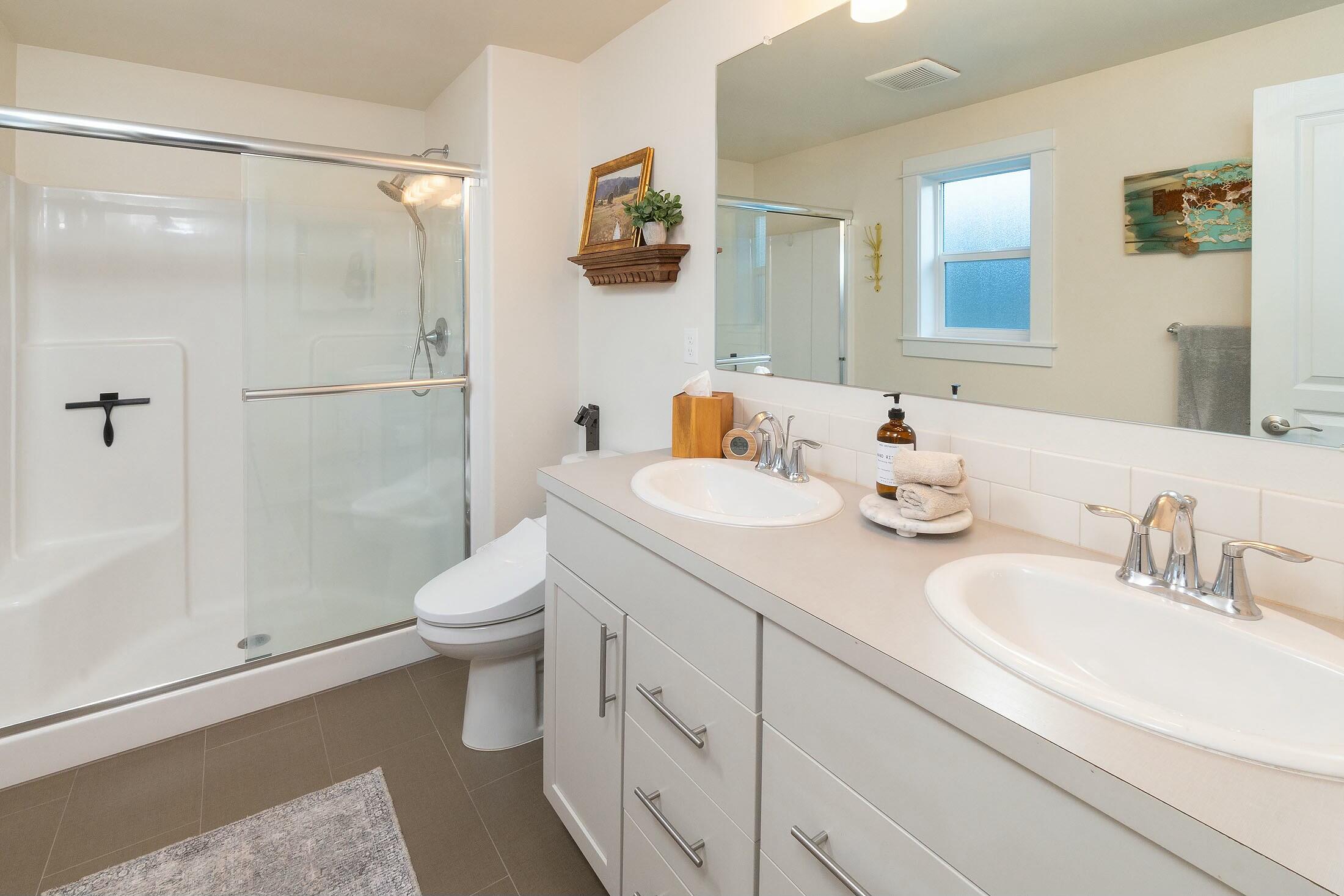 1801 Northeast Coby Way Bend, OR 97701 - Photo 11 of 34 Primary bathroom w/dual vanities, tile floors and walk-in shower.