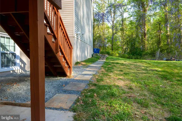 a view of a yard in front of a house with a small yard