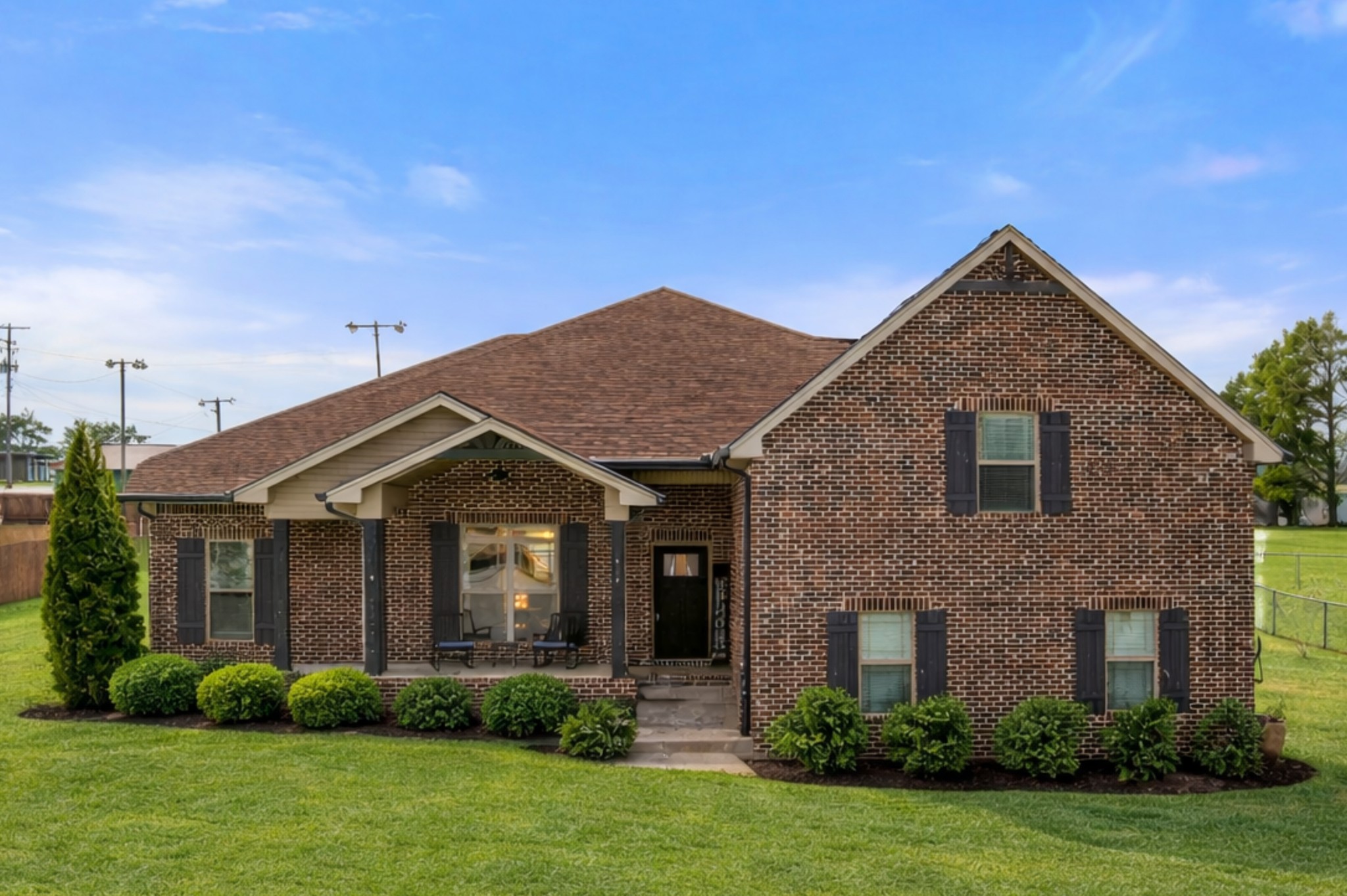 a front view of a house with garden