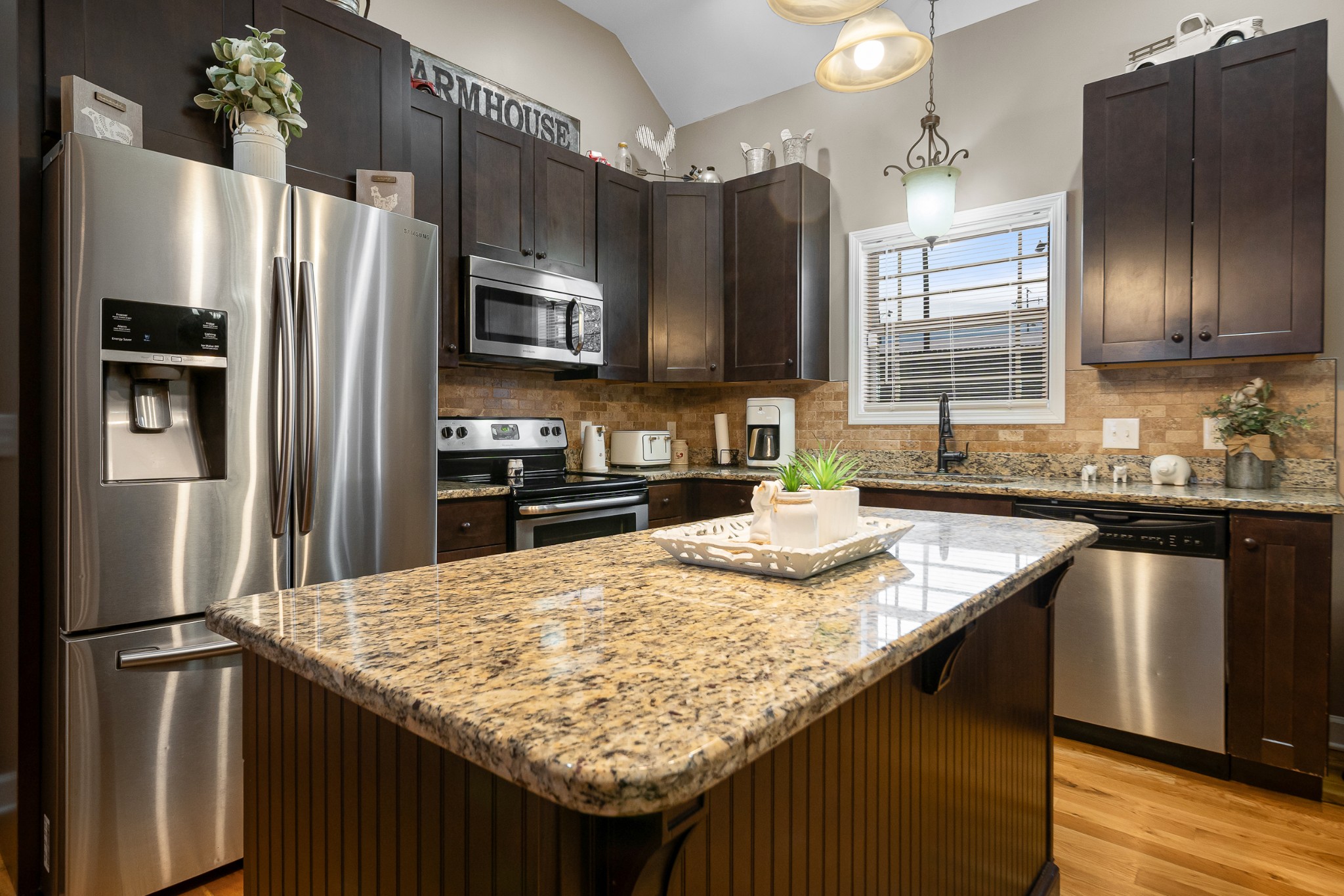 1934 Hygeia Road Greenbrier, TN 37073 - Photo 15 of 36 a kitchen with granite countertop a refrigerator and a sink