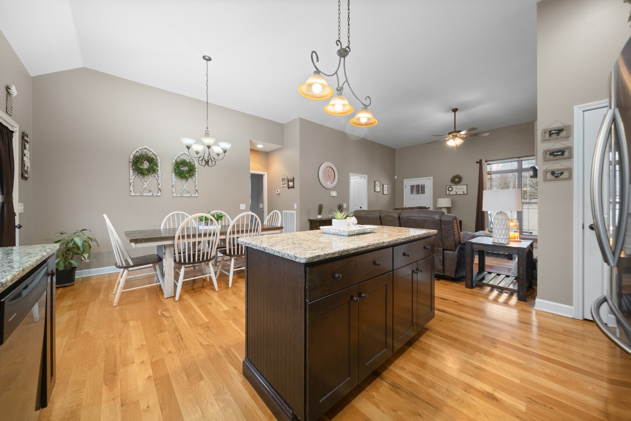 1934 Hygeia Road Greenbrier, TN 37073 - Photo 16 of 36 a kitchen with a sink a counter space dining table and a chandelier