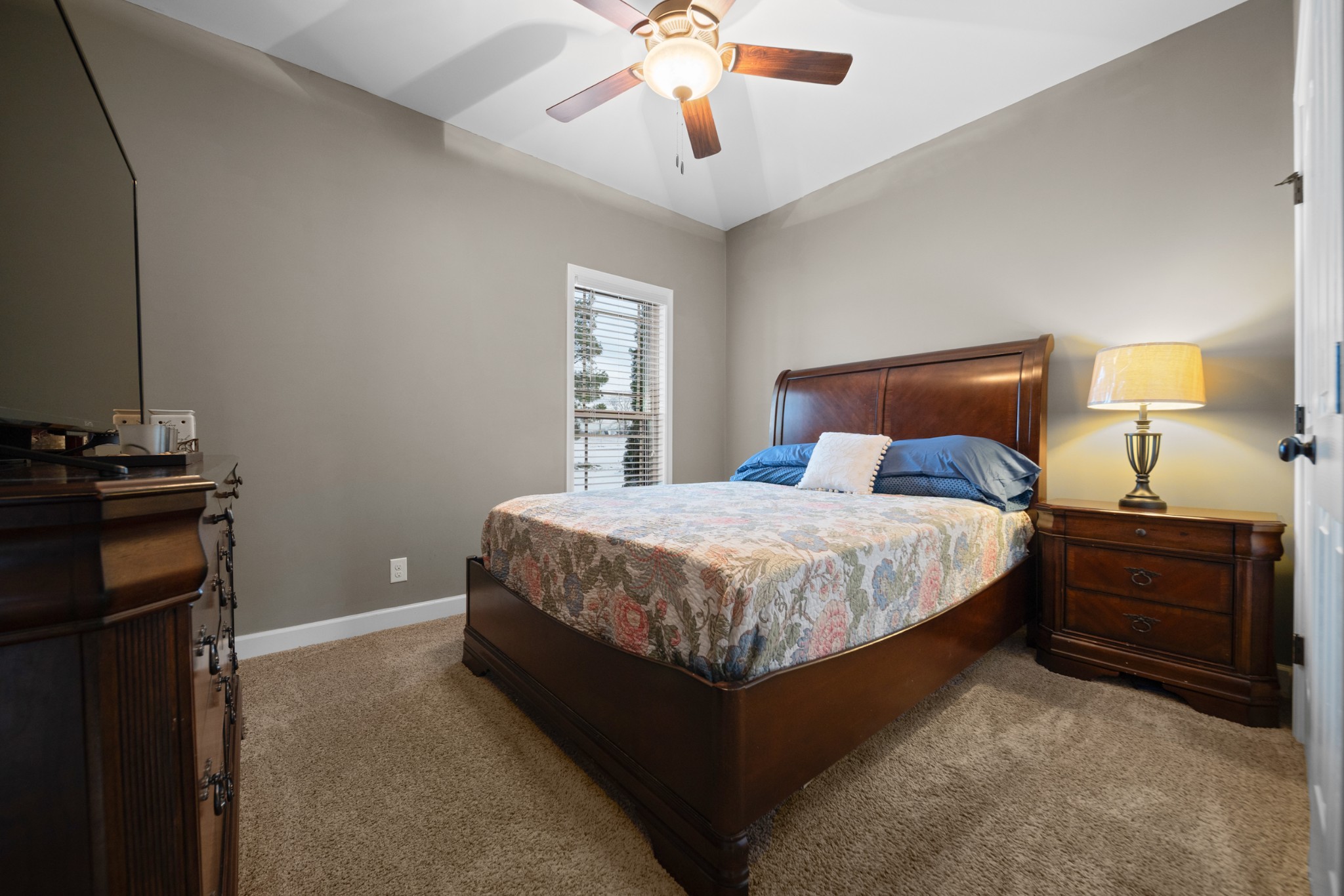 1934 Hygeia Road Greenbrier, TN 37073 - Photo 21 of 36 a bedroom with a bed and a lamp on the dresser