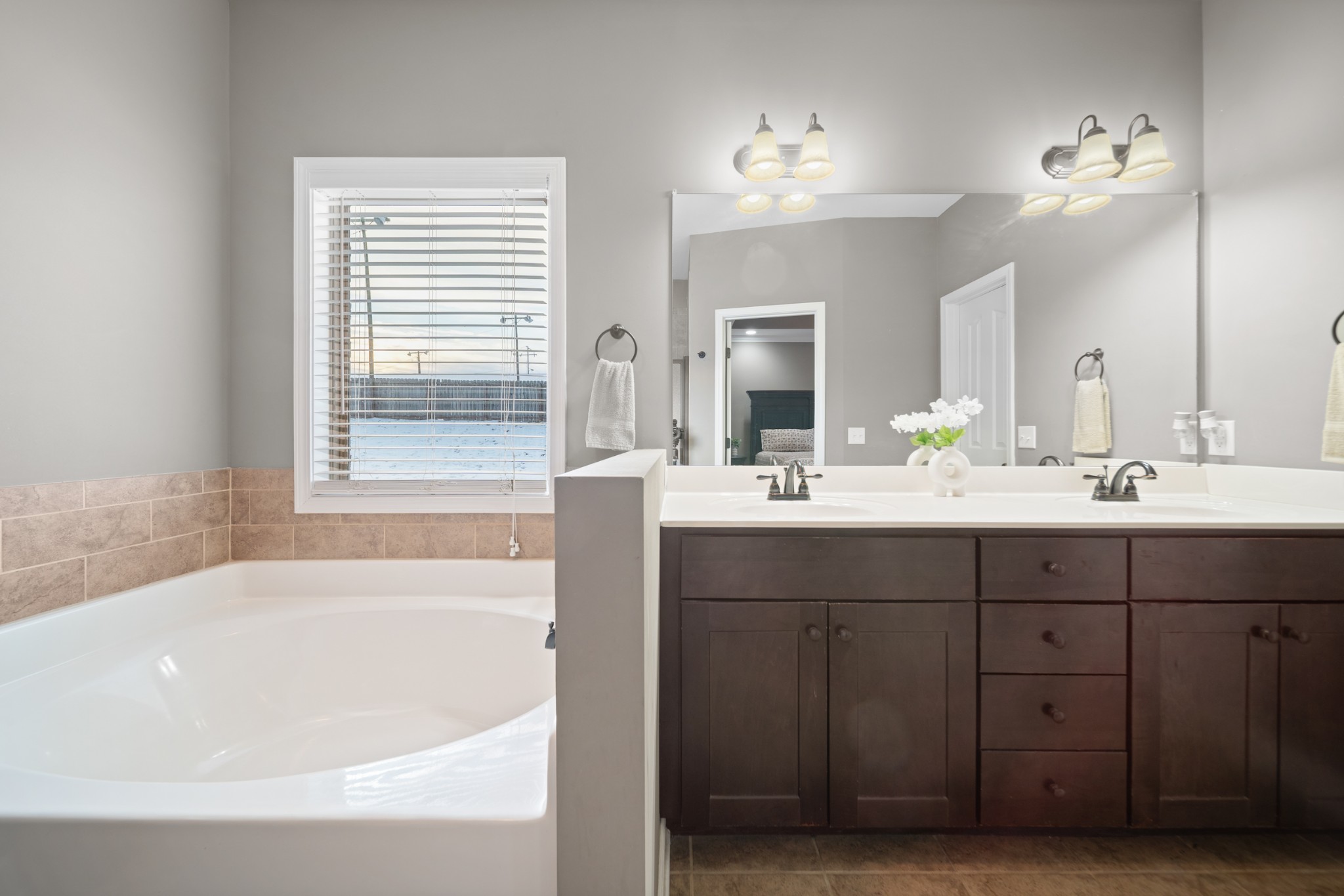 1934 Hygeia Road Greenbrier, TN 37073 - Photo 25 of 36 a bathroom with a tub a sink double vanity and a mirror