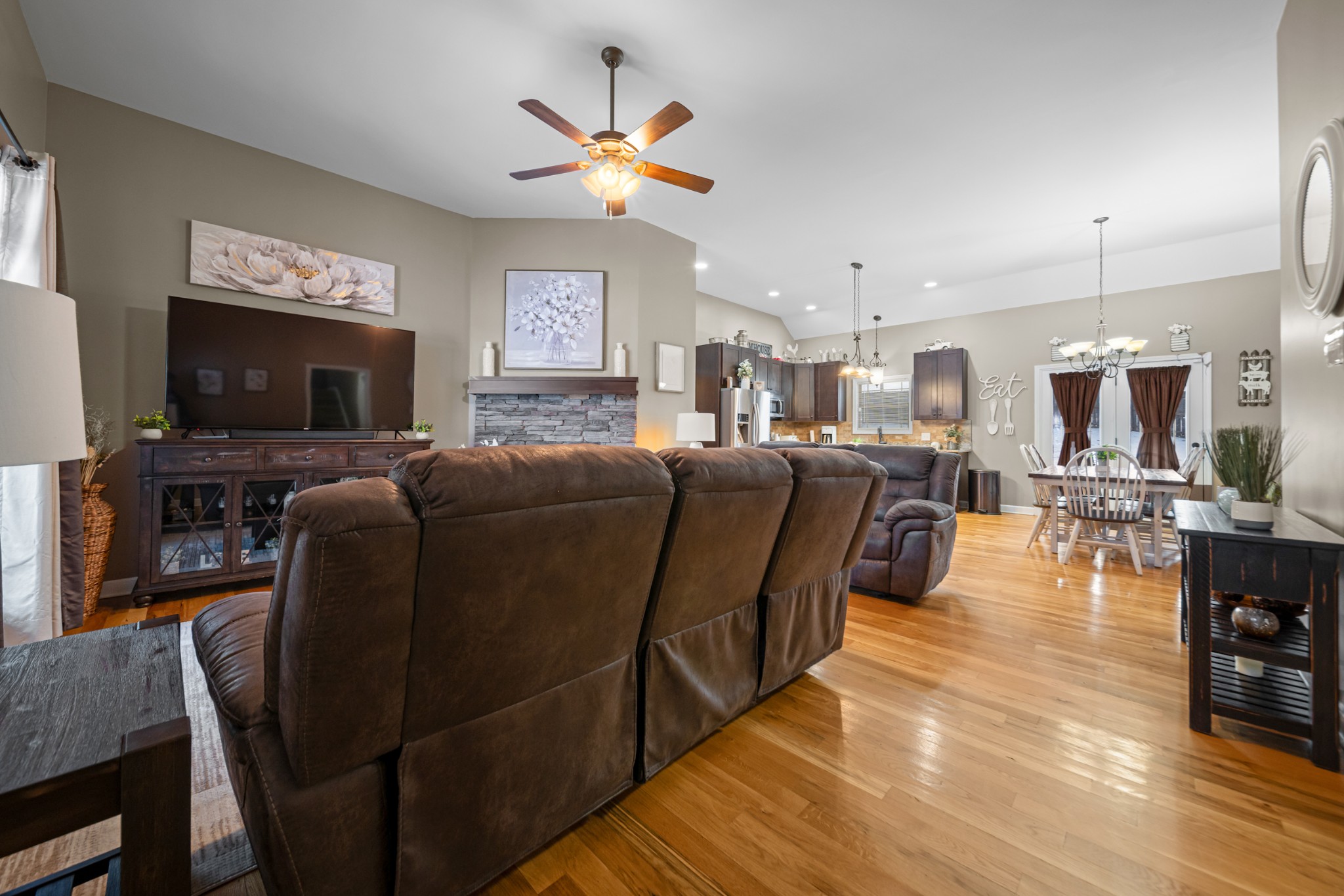 1934 Hygeia Road Greenbrier, TN 37073 - Photo 7 of 36 a living room with furniture flat screen tv and kitchen view