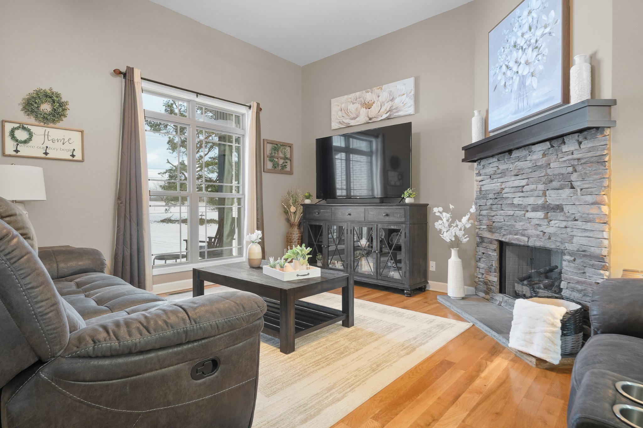 1934 Hygeia Road Greenbrier, TN 37073 - Photo 8 of 36 a living room with furniture and a fireplace