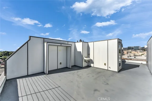 a view of a livingroom with an empty space and a balcony