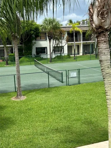 a view of a park with large trees