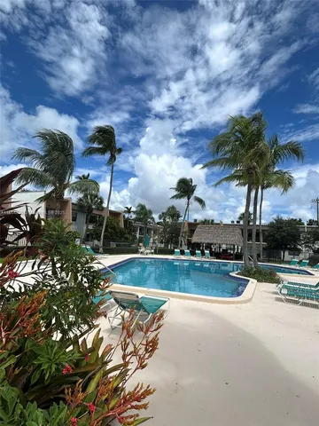 a view of a yard with swimming pool