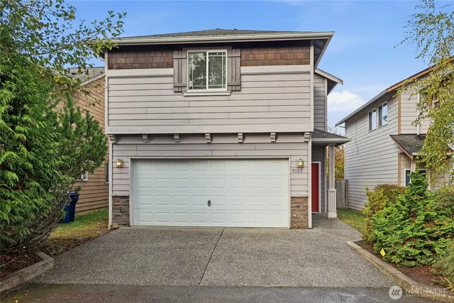 a front view of a house with a garage