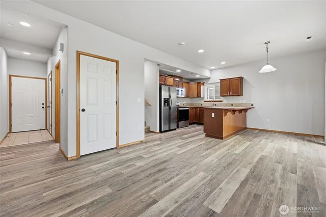 a view of kitchen and wooden floor