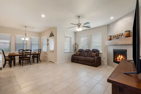 a large kitchen with stainless steel appliances kitchen island granite countertop a sink and cabinets