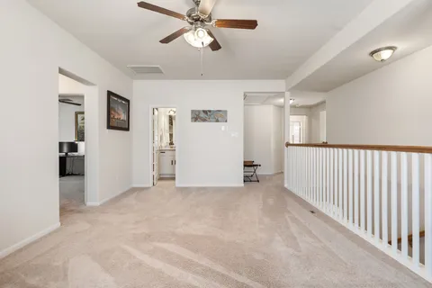 a bathroom with a granite countertop sink a mirror and a shower