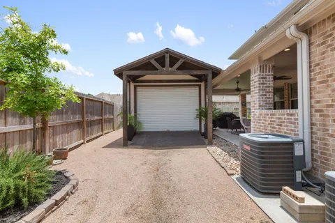 a view of front door and a yard