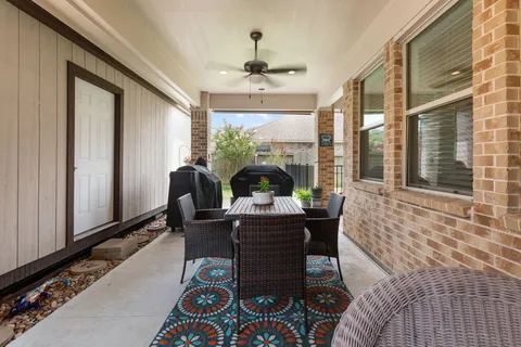 a bathroom with a granite countertop toilet a sink and a bathtub