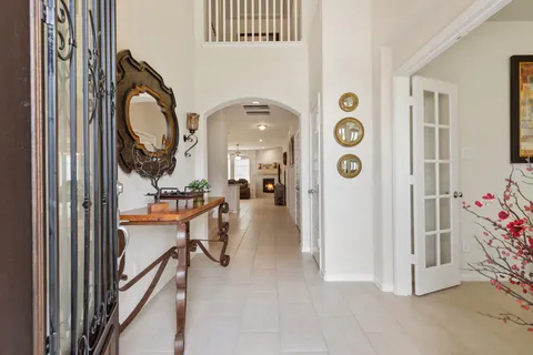 a view of a livingroom with furniture and front view of a house