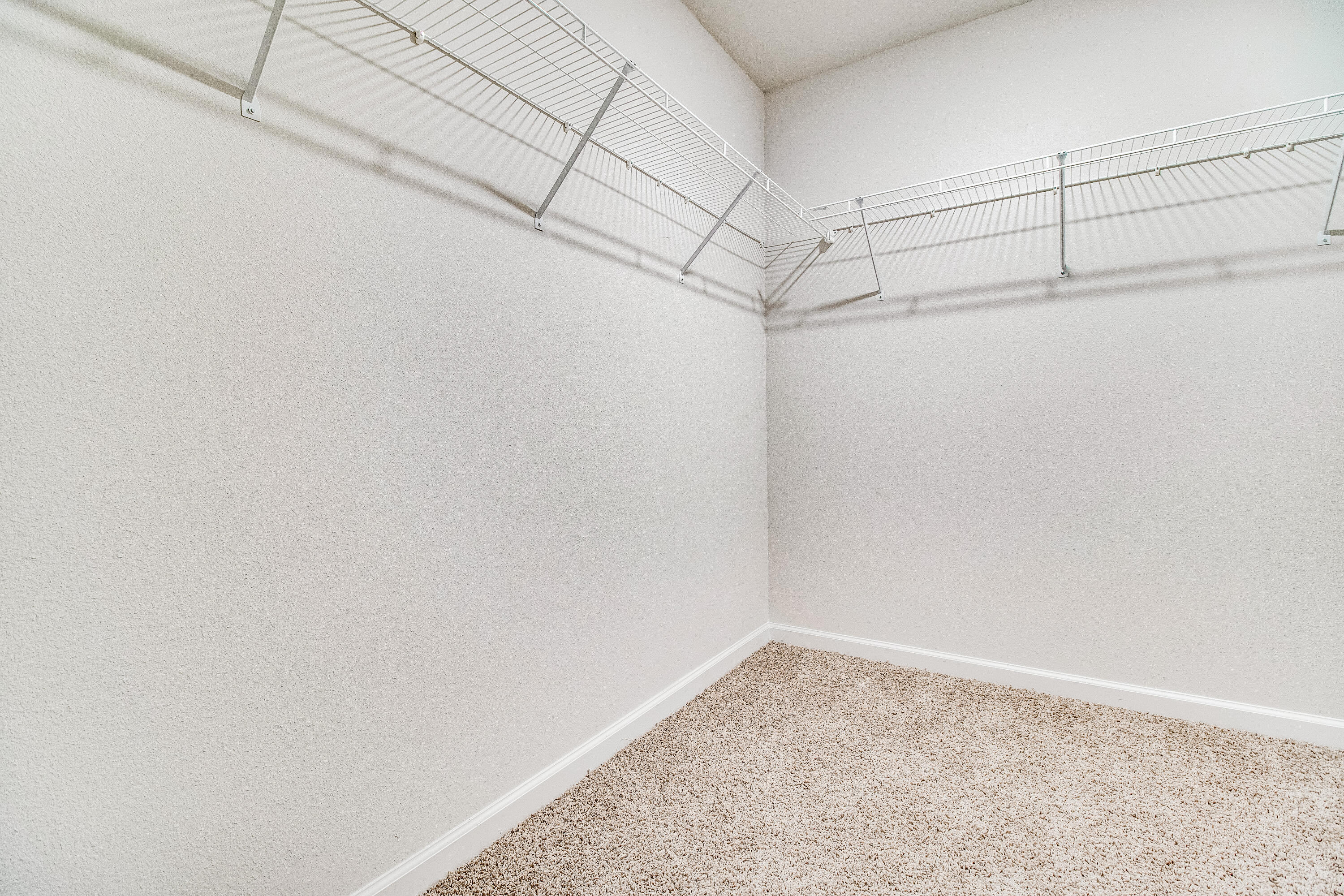 8587 Bluebell Street Milton, FL 32583 - Photo 19 of 30 a view of a room with racks on the wall