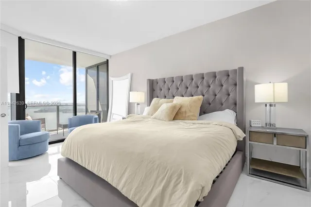 a bathroom with a toilet sink and shower