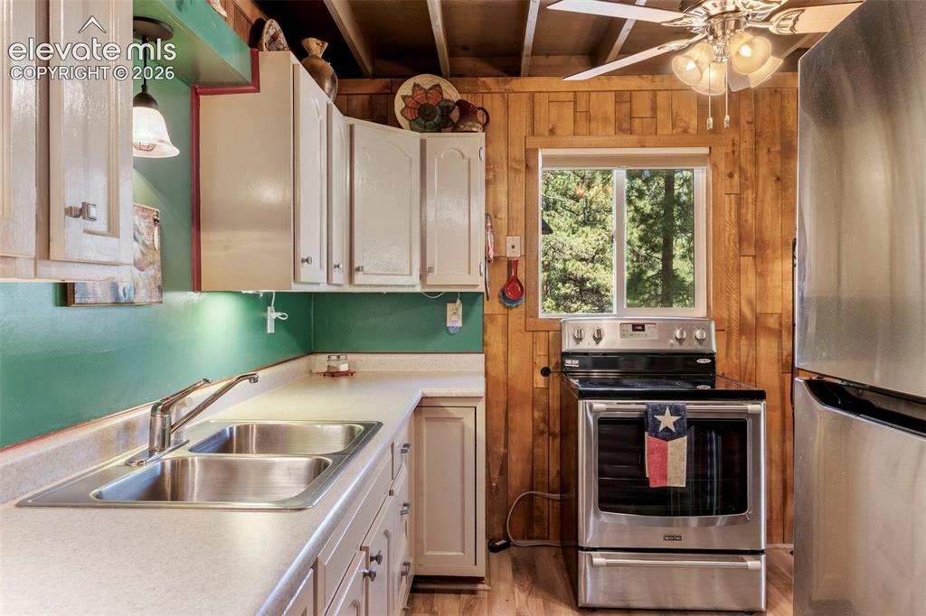 546 Pulver Road Lake George, CO 80827 - Photo 13 of 45 a kitchen with a stove and a sink