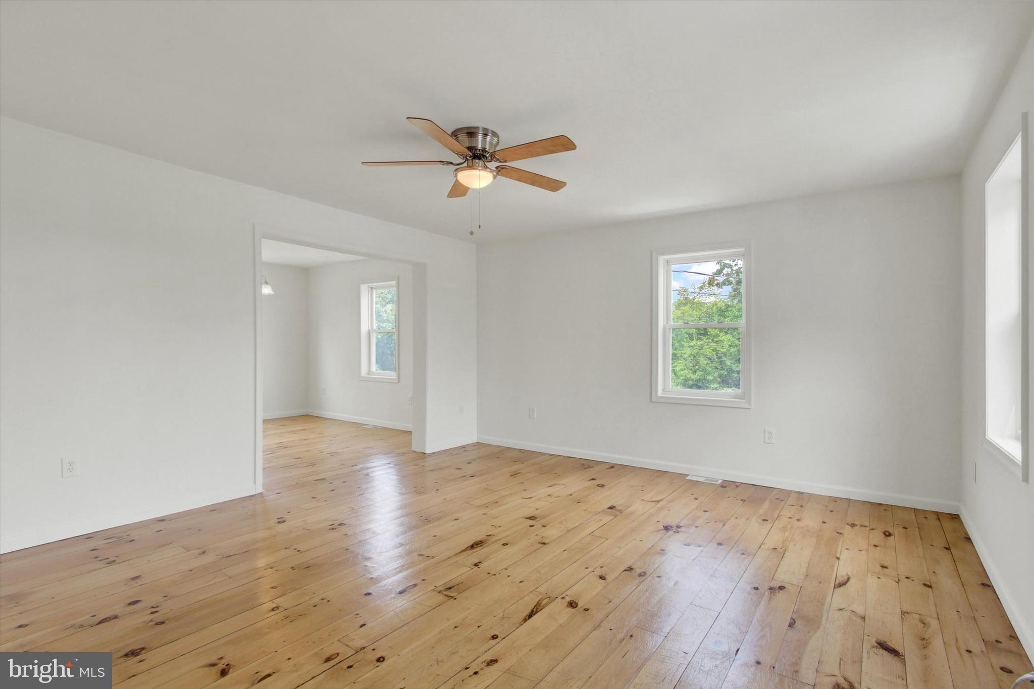 651 Alexander Spring Road Carlisle, PA 17015 - Photo 14 of 28 a view of empty room with wooden floor and fan