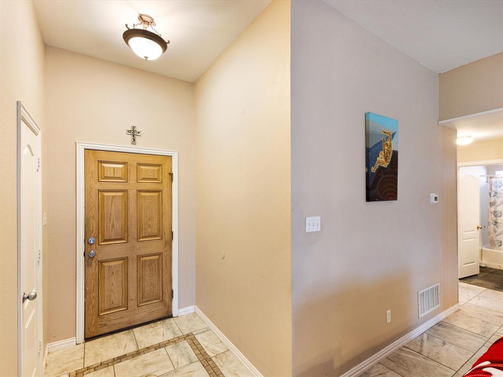 207 Quail Run Aubrey, TX 76227 - Photo 6 of 30 Foyer entrance with inlaid floor details and baseboards