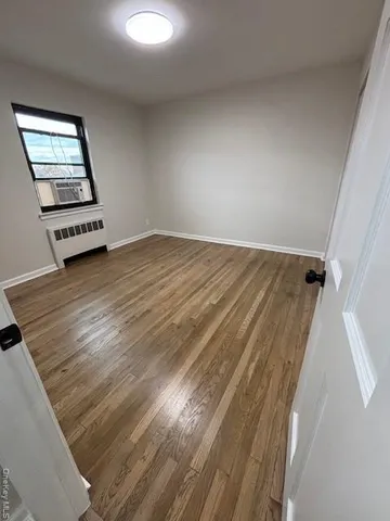 wooden floor in a hall with an entryway