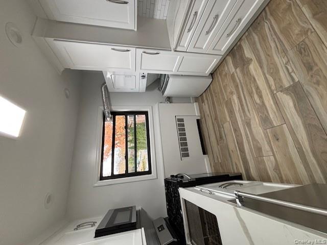 219-07 74th Avenue, Unit 447B2 Queens, NY 11364 - Photo 6 of 15 a bedroom with a bed and a flat screen tv