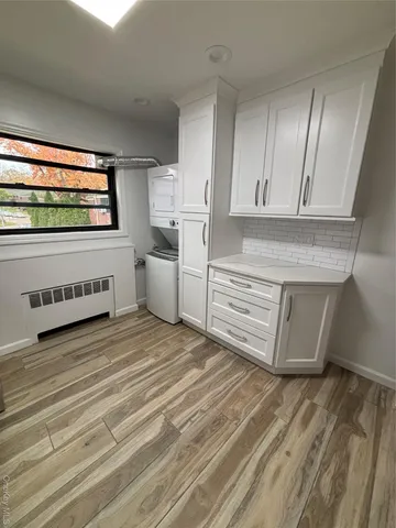 a view of a kitchen with wooden floor