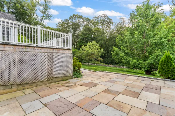 a view of a grassy field with trees
