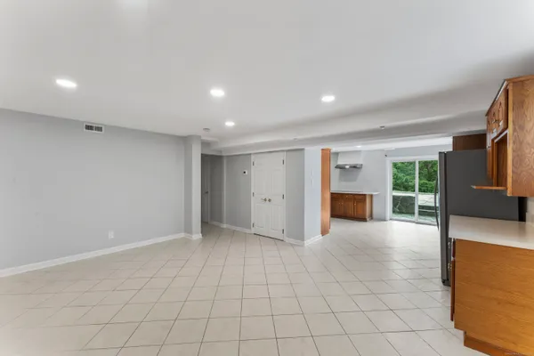 a view of an empty room with a window