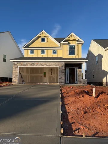 a front view of a house with yard