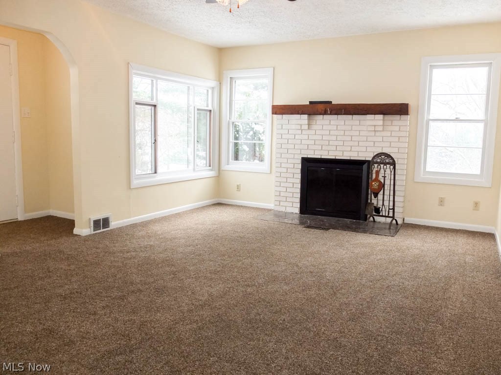 866 Randolph Road Mogadore, OH 44260 - Photo 2 of 19 Living room with a brick fireplace.
