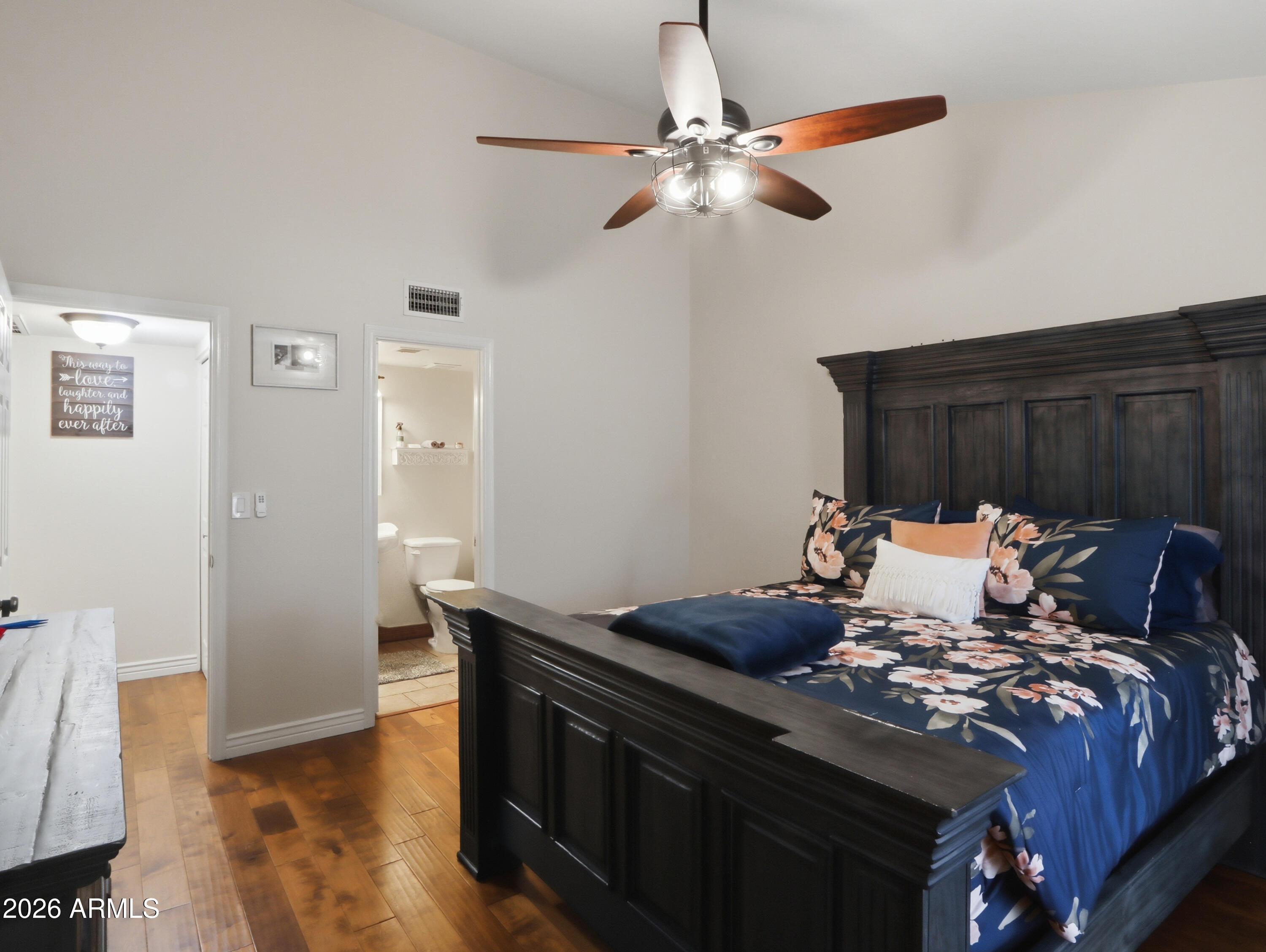 1402 East Osborn Road, Unit 2 Phoenix, AZ 85014 - Photo 13 of 29 a bed sitting in a bedroom next to a cabinet