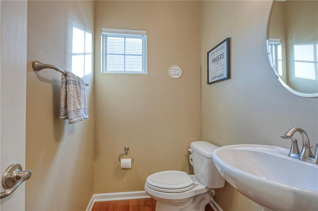 204 Broadstone Drive Mars, PA 16046 - Photo 12 of 32 a white toilet sitting next to a bathroom sink