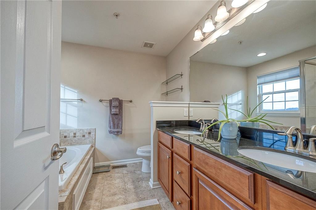204 Broadstone Drive Mars, PA 16046 - Photo 16 of 32 a kitchen with granite countertop a sink stove and cabinets