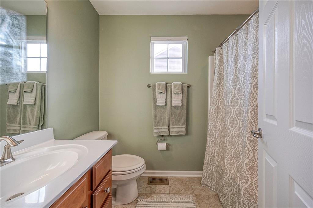 204 Broadstone Drive Mars, PA 16046 - Photo 22 of 32 a bathroom with a sink a toilet and shower