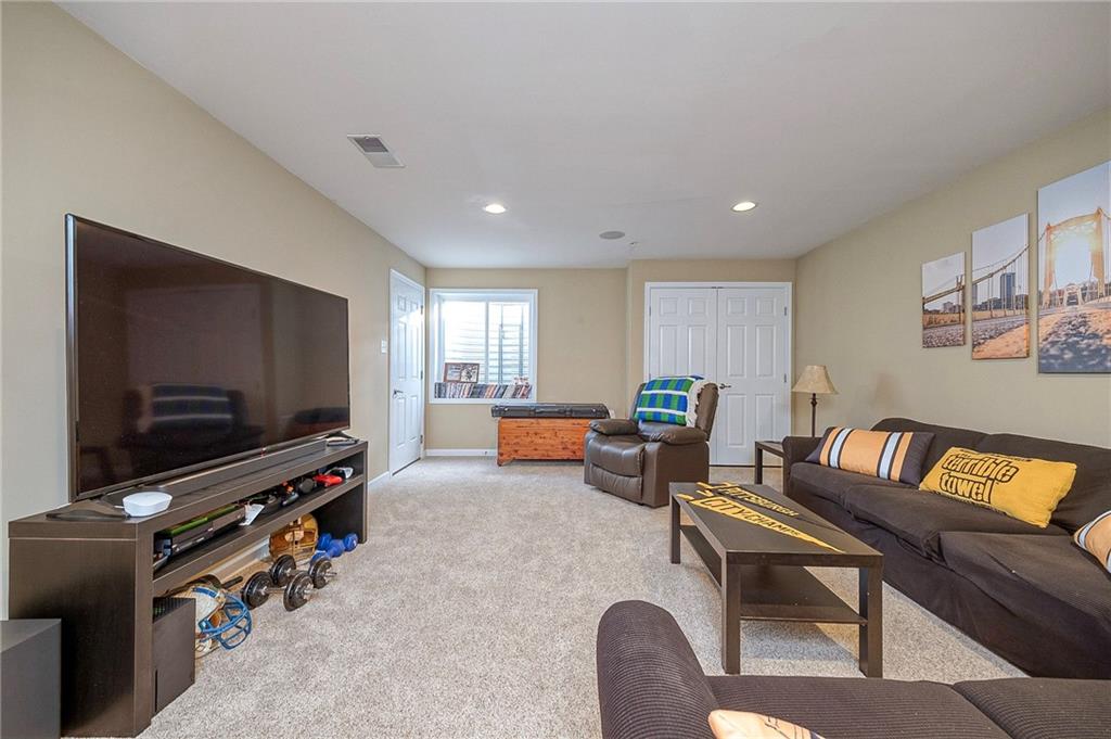 204 Broadstone Drive Mars, PA 16046 - Photo 23 of 32 a living room with furniture and a flat screen tv