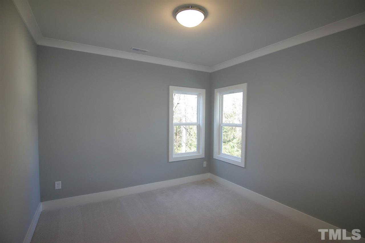 915 Marilyn Drive Raleigh, NC 27607 - Photo 22 of 25 an empty room with windows and closet